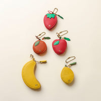 Collection of leather fruit keychains – whimsical strawberry, lemon, and banana charms made from premium leather