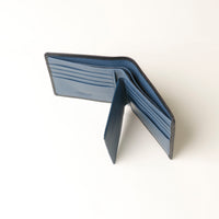 Open Blue leather wallet on a white background