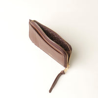 Brown card case wallet with a zipper on a white background