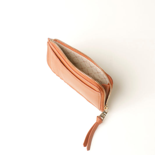Open light brown card case wallet with a strap on a white background