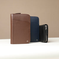 Front view of three a Brown blue and black Danilos Pebble leather Document Portfolio Alfaro on a beige background