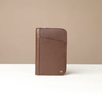 Front view of a Brown Danilos Pebble leather Document Portfolio Alfaro on a beige background