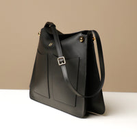 black leather soft structured quiet luxury leather bag
