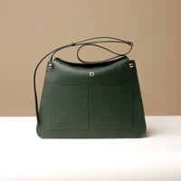 Green Penelope Sr. square leather bag – modern elegance with functional design