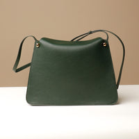 Green Penelope Sr. square leather bag – modern elegance with functional design