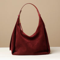 Angled view of burgundy suede Mia Minimale – modern slouchy silhouette with luxury finish