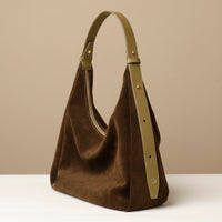 side view of Suede Mia Minimale in dark olive – classic slouchy hobo silhouette with a modern sculpted handle