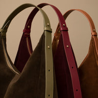Suede Mia Minimale trio – side view of pleated suede hobo bags in earthy tones with gold rivet detailing
