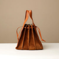 backside Close-up of tan Suede Papillon Sr. top handles – structured suede and leather craftsmanship