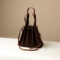 Suede Papillon Sr. in brown suede – pleated bucket bag with dual top handles and drawstring closure