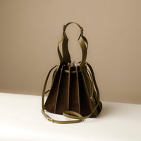 Green Olive Suede Papillon Sr. – elegant sculptural profile with wide-set handles