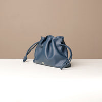 Top-down view of navy Sassy Satchel – interior lining and cinched closure with knotted leather ties