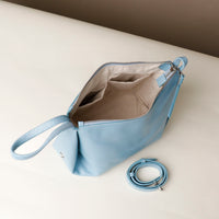 Close-up of Danilo’s logo on blue leather Silueta – premium craftsmanship detail