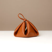 Top-down interior view of brown Silueta – microsuede lining with gold hardware