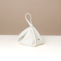 Multiple angles of cream Silueta Bag – handcrafted structured leather wristlet purse