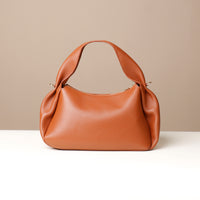 Back view of brown Aurora Bag – artisanal pleating and top-stitched handle detai