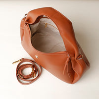 Aurora SS25 Bag in caramel leather – top-down with visible interior and hardware