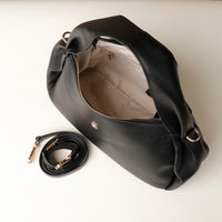 Side profile of black Danilo’s Aurora Soft Bag – modern structured silhouette