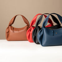 Collection of Aurora Soft Bags – pleated sculptural leather shoulder handbags in assorted hues