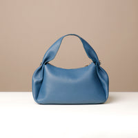 Aurora Soft Bag in blue – top-down view showing interior lining and detachable strap