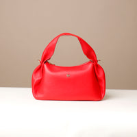 Aurora Bag in cherry red – bold pleated leather handbag with sculpted handle