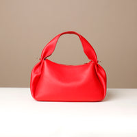 back of cherry red Aurora Bag – curved balloon silhouette and artisanal details