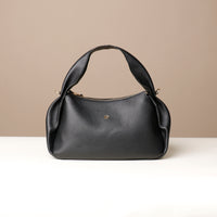 Aurora Bag in black leather – sculpted shoulder bag with ruched side seams