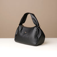 Side profile of black Danilo’s Aurora Soft Bag – modern structured silhouette
