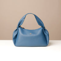 Aurora Soft Bag in slate blue – pleated sculptural design with crossbody strap