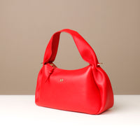 Front view of red Aurora Soft Bag – vibrant statement leather shoulder bag