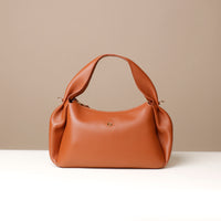 Brown Aurora Soft Bag – smooth sculpted silhouette with crossbody versatility