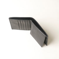 black leather wallet opened upper view on a white background