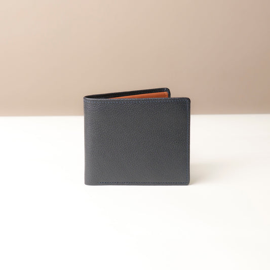 Blue leather wallet on a white surface with a beige background