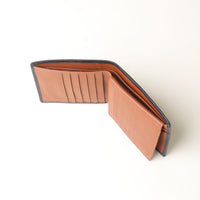 Brown leather wallet on a white background upper view