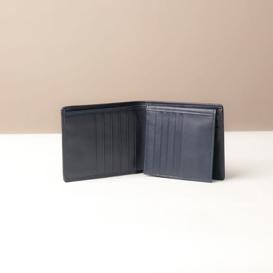 Dark Blue leather  Isa wallet open on a beige background