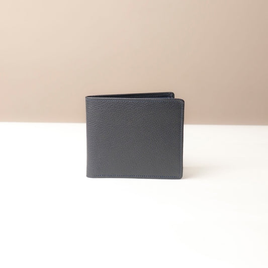 Dark blue leather Isa wallet wallet on a beige background