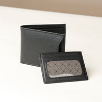 Front of a black pebble leather Milano wallet with card case holder over a beigh background