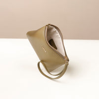 Beige wristlet pouch with a strap on a light beige background