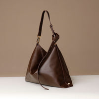 Zesté Crossbody Lux in brown leather – angled front view of luxury convertible shoulder and crossbody bag by Danilo’s