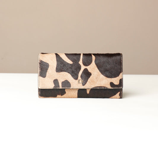 patterned hair on Danilos wallet on a beige background