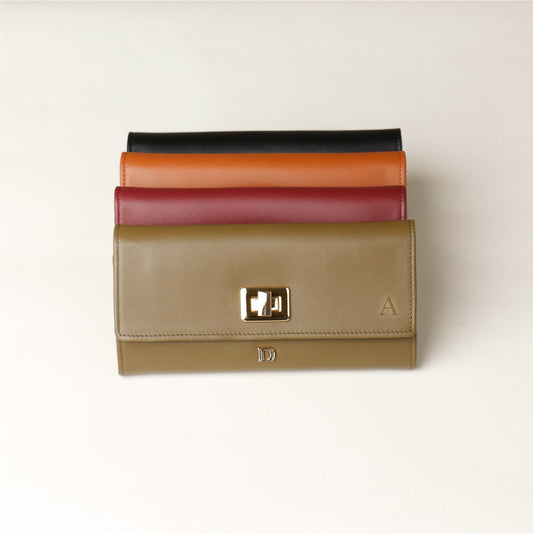 Front view of a green, red, brown and black danilos leather jewelry organizer mishka in a white background