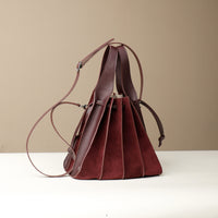 Back view of Danilo’s Papillon bag in burgundy – artisanal drawstring bucket bags