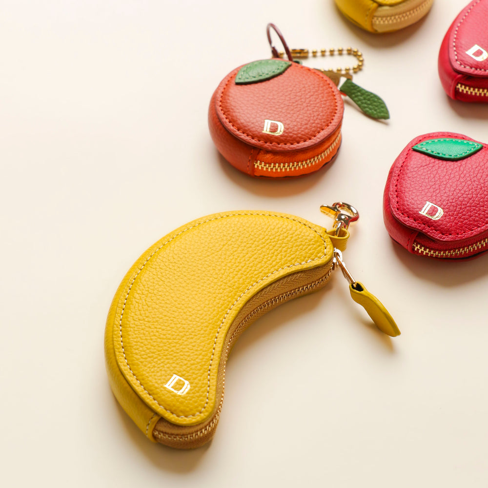 Banana, strawberry, and lemon leather keychains by Danilo’s – handcrafted fruit-shaped accessories with gold hardware
