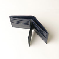 Opened Black leather wallet on a white background