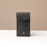 front view of a black danilos leather multi smartphone alessia over a beige background