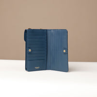front view of a open blue danilos leather multi smartphone alessia with 19 slots over a beige background