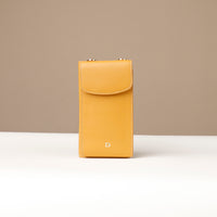 front view of a yellow danilos leather multi smartphone alessia over a beige background