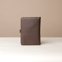 Back view of a brown Danilos pebble leather inskpirator on a beige background