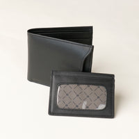 Front of a black nappa leather Milano wallet with a card case holder over a beige background