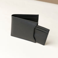 Front of a black pebble leather Milano wallet with card case holder that comes out of one of the sides